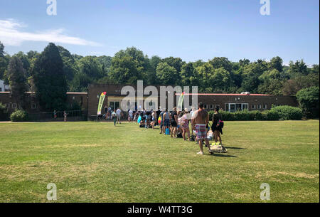 High Wycombe, Buckinghamshire. 25th July 2019. UK Weather: Queue of people in the hot weather waiting to gain entry to a local outdoor swimming pool in High Wycombe during the July UK Heatwave at Rye Lido Centre, High Wycombe on 25 July 2019. Photo by Andy Rowland. Credit: PRiME Media Images/Alamy Live News Stock Photo