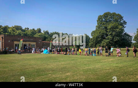 High Wycombe, Buckinghamshire. 25th July 2019. UK Weather: Queue of people in the hot weather waiting to gain entry to a local outdoor swimming pool in High Wycombe during the July UK Heatwave at Rye Lido Centre, High Wycombe on 25 July 2019. Photo by Andy Rowland. Credit: PRiME Media Images/Alamy Live News Stock Photo