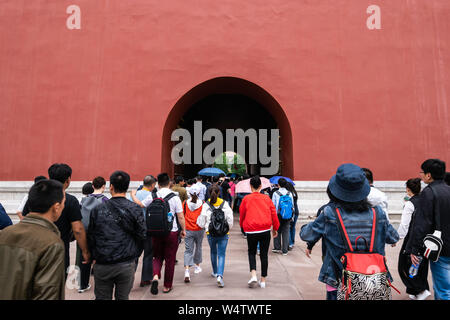 Beijing, China -May 20, 2018:View of people walking to travel  trough the tunnel gate at Forbidden city which is a palace complex in central Beijing, Stock Photo