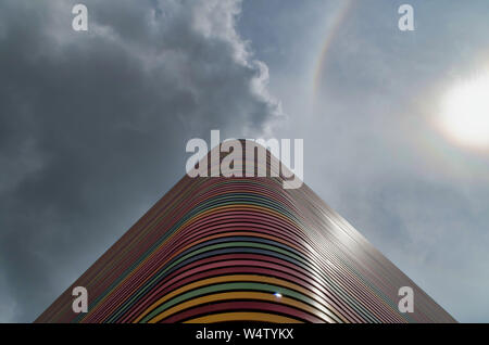 Low angle view of rainbow over building against sky. Stock Photo