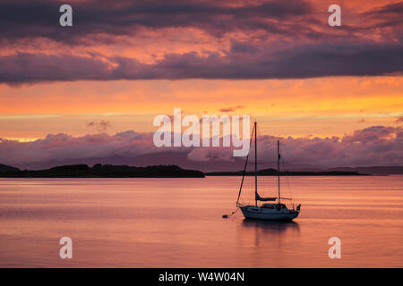 Boat on stunning sunset over Loch Etive at Connel, nr Oban, Scotland Stock Photo