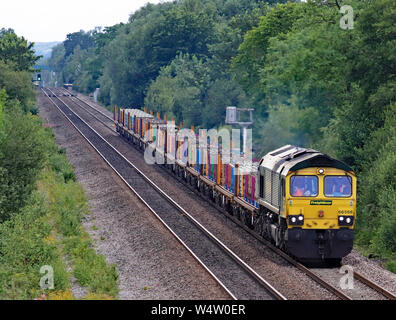 Freightliner locomotive no 66568 travelling from Burton on Trent is about to pass the North Staffordshire Junction with pulling a freight train. Stock Photo