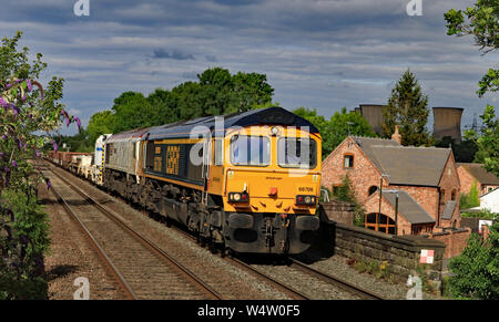GBRF locomotives no 66706 “Nene Valley” and 66721 “Harry Beck” travelling through Willington in Derbyshire pulling a freight train. Stock Photo