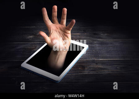 Smart phone addiction concept on red background. hand is drowning Stock Photo