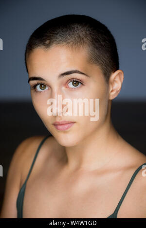 Portrait of 20 year old female with shaved head Stock Photo