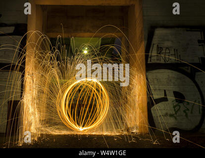 Light painting / light drawing with fire and steel wool Stock Photo