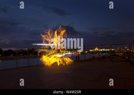 Light painting / light drawing with fire and steel wool Stock Photo