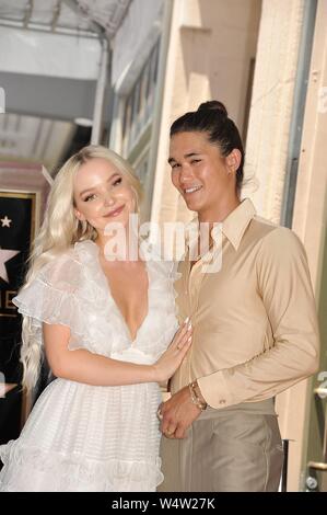 Los Angeles, CA, USA. 24th July, 2019. Dove Cameron, Booboo Stewart at the induction ceremony for Star on the Hollywood Walk of Fame for Kenny Ortega, Hollywood Boulevard, Los Angeles, CA July 24, 2019. Credit: Michael Germana/Everett Collection/Alamy Live News Stock Photo