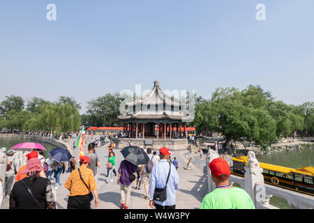 Beijing, China - May 25, 2018: View of people travel around the Summer Palace,  a vast ensemble of lakes, gardens and palaces,  in Beijing, China. Stock Photo