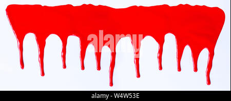 Red paint dripping on a white background Stock Photo
