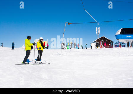 Kopaonik, Serbia - January 20, 2016: Ski resort Kopaonik, Serbia, ski lift, ski slope, people going down from the lift and skiing Stock Photo