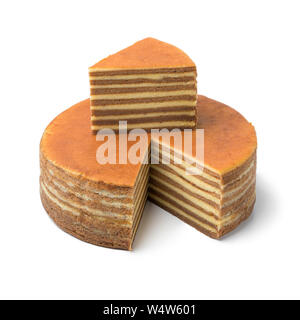 Asian homemade layer cake and a piece on top of the cake isolated on white background Stock Photo