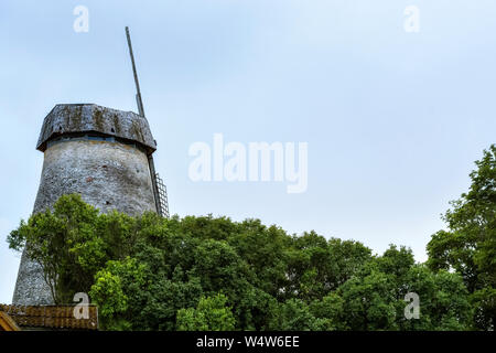 Old Estonian windmill against the blue sky in Rakvere. Stock Photo
