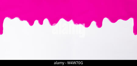 Pink paint dripping on a white background Stock Photo