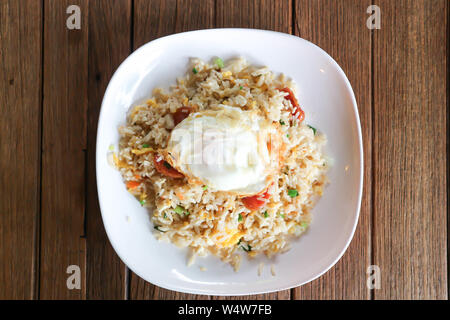 stir-fried rice with deep fried sausage ,egg and vegetable Stock Photo