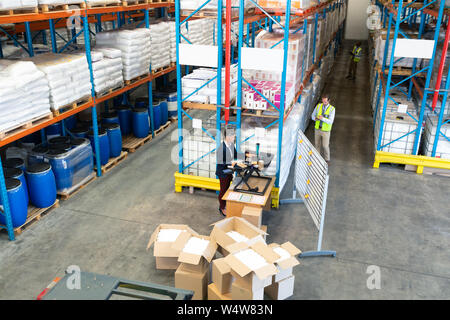 Warehouse staff working together in warehouse Stock Photo