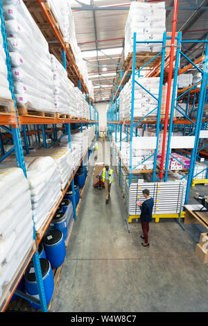 Warehouse staff working together in warehouse Stock Photo