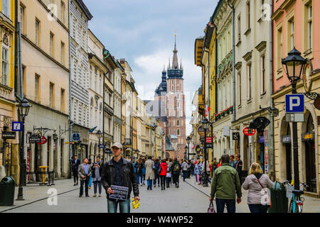 Krakow, Poland - May 21, 2019: Tourists walking through the old city of Krakow Stock Photo
