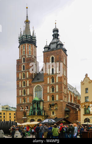 Krakow, Poland - May 21, 2019: St Mary's Basilica and Main Market Square in Krakow Stock Photo