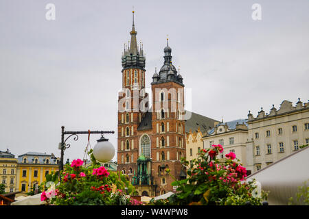 Krakow, Poland - May 21, 2019: View of flowers in the foreground, in the background the church is out of focus Stock Photo