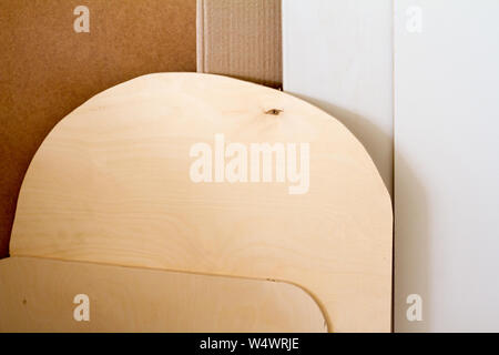 A wooden pillars and thick boards in the furniture workshop are ready to work joiner, selective focus Stock Photo