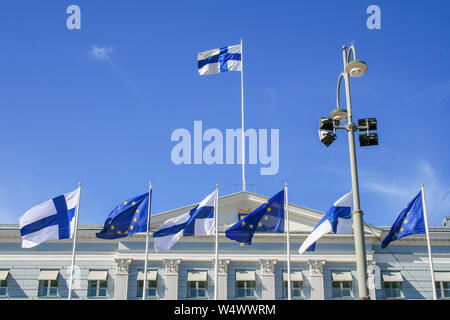 Flags of Europe and Finland waving together on the Presidential Palace in Helsinki, European Union Stock Photo