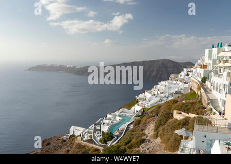 View of Imerovigli and over Santorini caldera to Oia from Imerovigli on a hot day Stock Photo