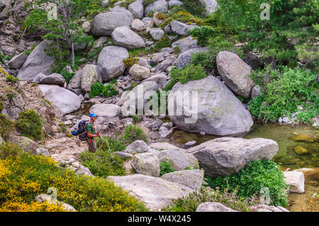Elderly hiker during the GR20 hike in Corsica, France Stock Photo