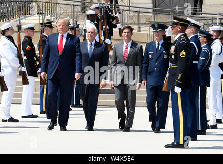 United States President Donald J. Trump (L) walks past an honor guard with the new US Secretary of Defense Dr. Mark T. Esper (2nd, R), US Vice President Mike Pence (2nd, L) and US Air Force General Paul J. Selva, Vice Chairman of the Joint Chiefs of Staff (L), at the Pentagon, Thursday, July 25, 2019, Washington, DC. The Department of Defense has been without a full-time leader since former Secretary Jim Mattis resigned in December 2018. Credit: Mike Theiler/Pool via CNP /MediaPunch Stock Photo