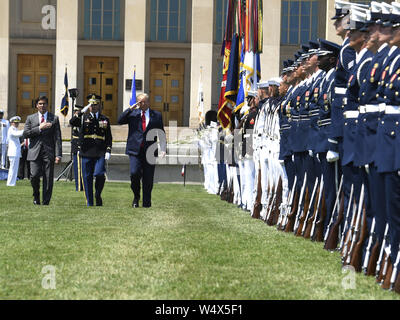 July 25, 2019, Washington, District of Columbia, USA: United States President Donald J. Trump (R) salutes as he reviews troops with the new US Secretary of Defense Dr. Mark T. Esper (L) and US Air Force General Paul J. Selva, Vice Chairman of the Joint Chiefs of Staff, at the Pentagon, Thursday, July 25, 2019, Washington, DC. The Department of Defense has been without a full-time leader since former Secretary Jim Mattis resigned in December 2018. Credit: Mike Theiler/Pool via CNP Credit: Mike Theiler/CNP/ZUMA Wire/Alamy Live News Stock Photo