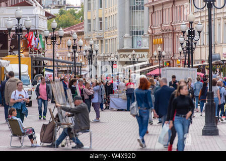 MOSCOW - JUL 19: Old Arbat Street with Souvenir Shops and Tourists in Moscow on July 19. 2019 in Russia Stock Photo