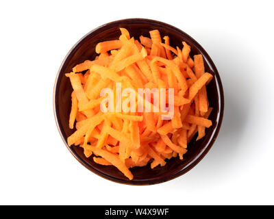Fresh organic shredded carrots in small white bowl. Raw grated carrots isolated on white with clipping path. Top view or flat lay. Stock Photo