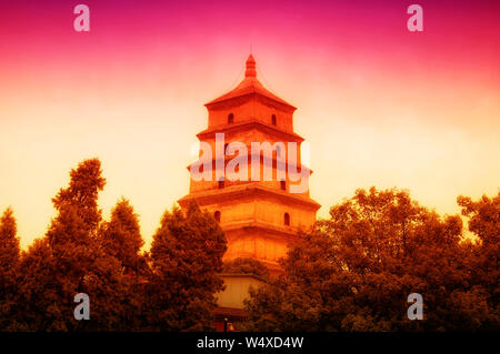 The giant wild goose pagoda or Dayan Pagoda at sunset located in Da Cien Temple complex in Xian China on an overcast day. Stock Photo