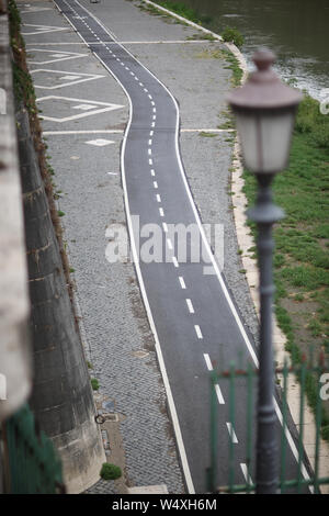 Top view on a narrow asphalt road running along the river. Stock Photo