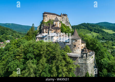 Orava castle - Oravsky Hrad in Oravsky Podzamok in Slovakia. Medieval stronghold on extremely high and steep cliff. Aerial view Stock Photo