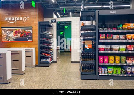 Empty interior with logo at Amazon Go concept store, a physical retail store operated by Amazon in which shoppers are able to take items from shelves and exit without a checkout process, having their items automatically charged to their Amazon Prime account, San Francisco, California; the store uses advanced machine vision and artificial intelligence technologies to automatically record purchases, December 25, 2018. () Stock Photo