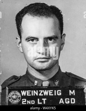 Official United States Signal Corps head and shoulders portrait, taken during World War 2, of soldier 2nd Lieutenant Max Weinzweig (aka Warren), with short haircut, 1942. () Stock Photo