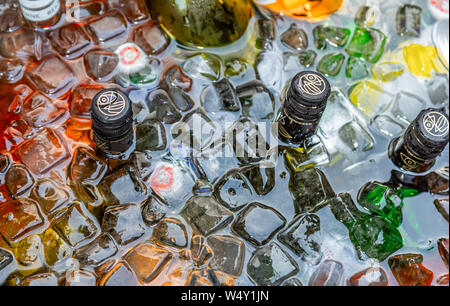 Various types of bottles in an ice bath. Stock Photo