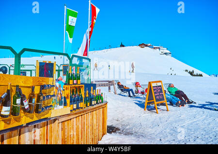 ZELL AM SEE, AUSTRIA - FEBRUARY 28, 2019: The open air lounge bar on the top of Schmitten mount offers large amount of famous alcohol drinks, on Febru Stock Photo