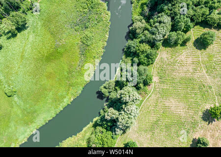aerial view of beautiful summer natural river landscape with green trees on field Stock Photo