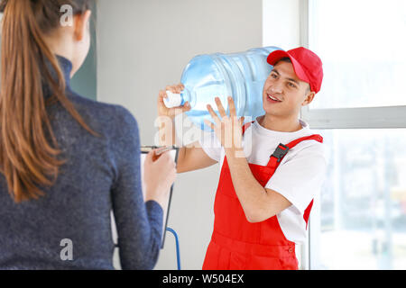 Man delivering bottle of water to customer Stock Photo