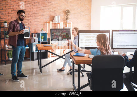 Team of programmers working in office Stock Photo