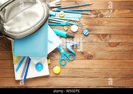Different school stationery on wooden background Stock Photo