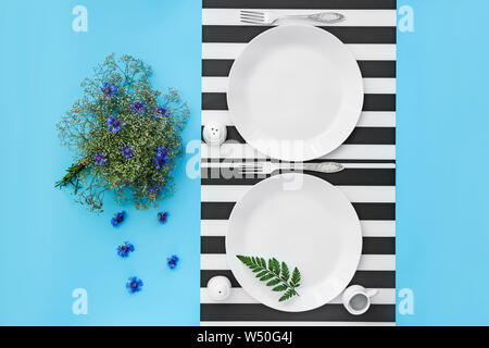 Beautiful table setting with floral decor on color background Stock Photo