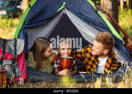Happy family spending weekend in forest Stock Photo