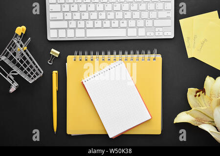 Composition with stationery and computer keyboard on dark background Stock Photo