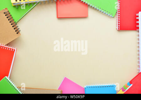 Stylish notebooks on color background Stock Photo