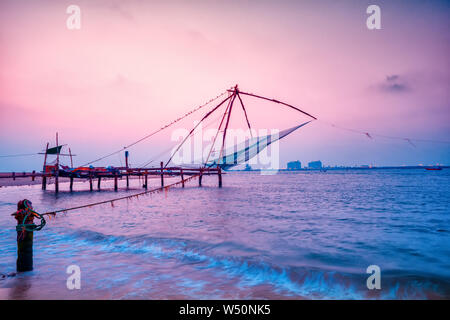 beautiful night scene of Kochi chinese fishnets in twilight Kochi, Kerala. Fort Kochin, Kochi, Kerala, south India, neon colors Stock Photo