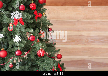Beautifully decorated Christmas tree on wooden background Stock Photo