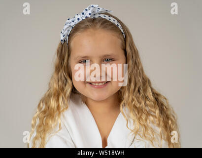 Cute charming happy excited and cheerful young kid modeling and posing with great confidence and self esteem. Close up Beauty portrait in Positive hum Stock Photo